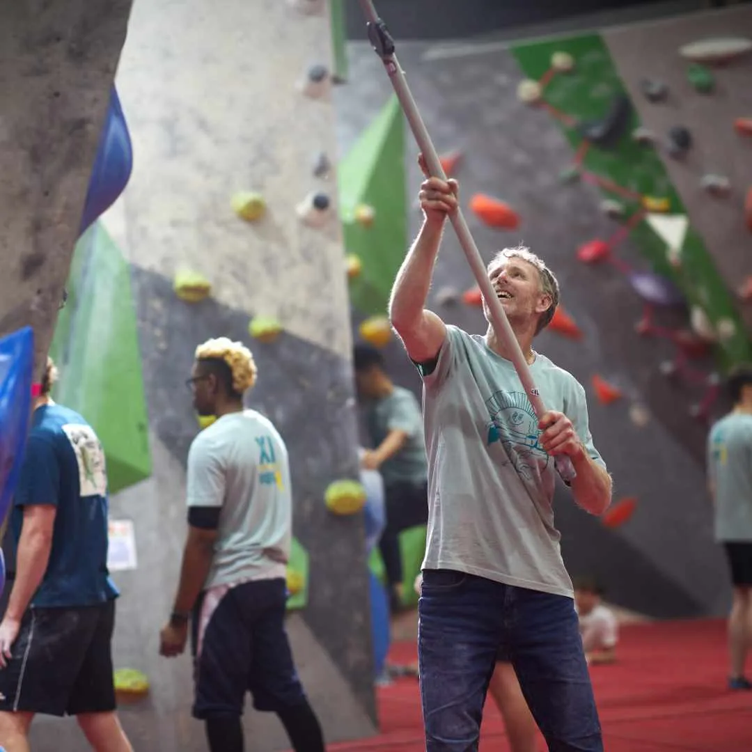 A group of adults climbing together at the centre